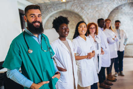 hospital, profession, people and medicine concept - group of happy doctors at hospitalの写真素材