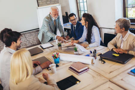Speaker at business workshop entrepreneur giving a presentation about positive business growth to  colleagues in the office.の写真素材