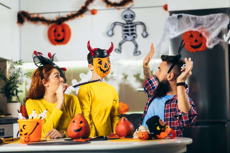 Family has fun in Halloween time at home