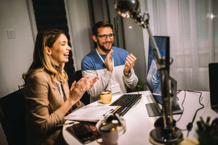 Couple working on new project. They working late into the night.の写真素材