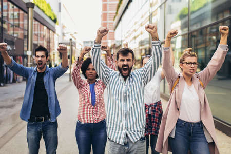 Group of people activists protesting on streets