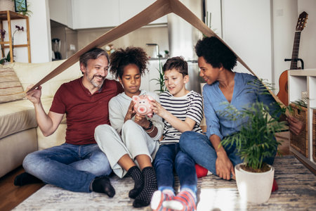 Portrait of a beautiful happy and smiling family just arrived in the new house to start a new journey together.の写真素材