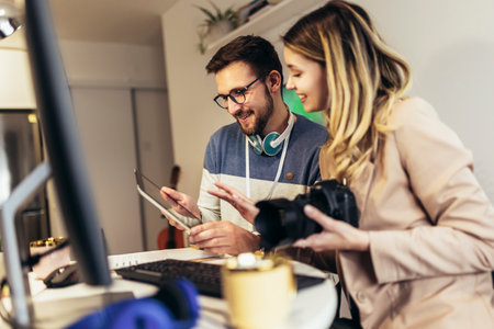 Photo reporters working in office