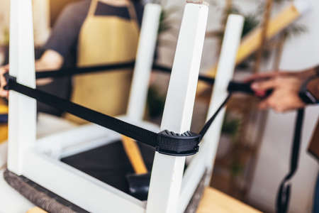 Close up photo of young male carpenter and his son working in workshopの写真素材