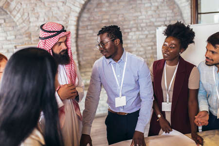 Multicultural business people meeting and talking about business investment. Arab business man in a meeting.の写真素材