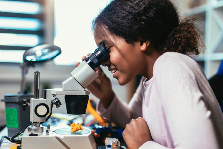 Smart Young African American Schoolgirl is Studying Electronics in Her Science Hobby Robotics...