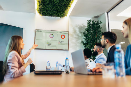 Group of businesspeople having a briefing in a boardroom. Businesspeople working together in a...