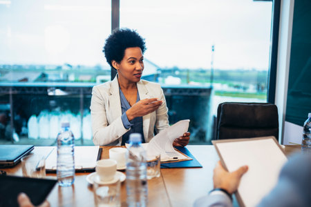 Portrait of a successful woman, businesswoman working in a modern office.の写真素材