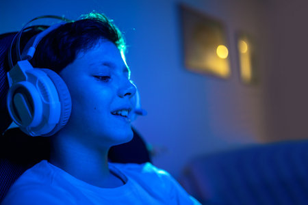 Young gamer connecting online and playing online video gamesの写真素材