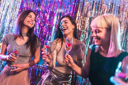 Group of female friends dancing in the clubの写真素材