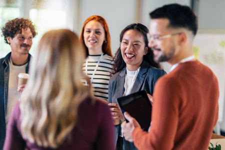 Happy diverse colleagues have fun at lunch break in office, smiling multiracial employees laugh and...