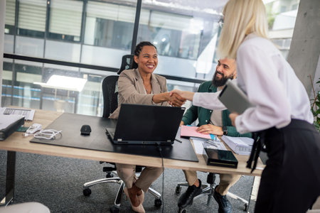 Human resource team talking to a candidate during a job interview in the office.の写真素材