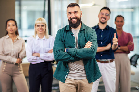Portrait of a successful group of business people at modern office looking at camera.の写真素材