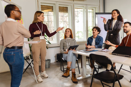 Two women holding business presentation about success in business