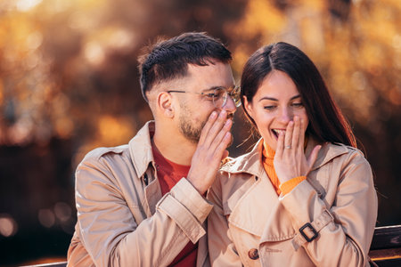 Boyfriend telling girlfriend a surprising newsの写真素材