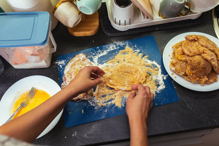 Close-up of making schnitzel
