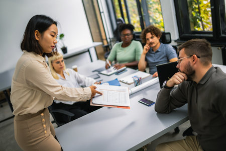 International workers group and team leader having teamwork discussion managing project at work in meeting room.の写真素材