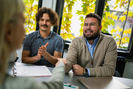 Human resources managers conducting job interviews with applicants in the office