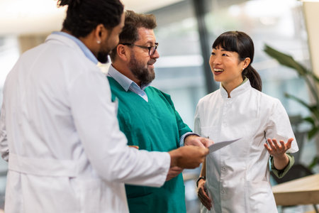 Group of multiracial doctors standing and discussing about resultsの写真素材