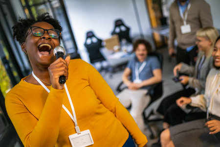 Business people making team training exercise during team building seminar singing karaoke