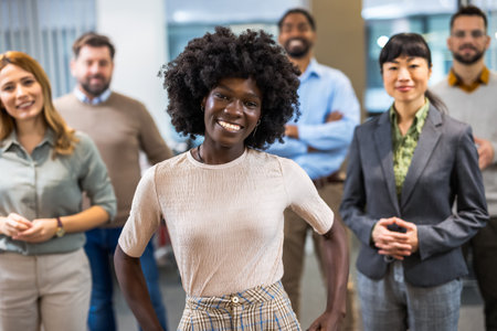 African American boss standing in front of her colleagues in the officeの写真素材