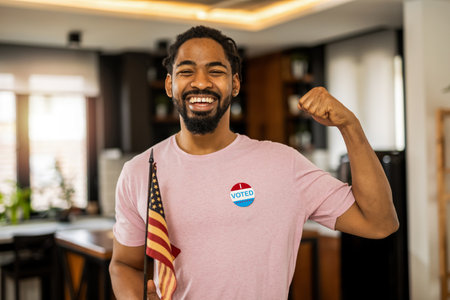 African American man standing with an American flag after voting.