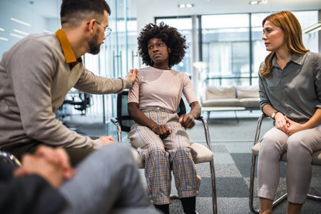 Group of people sitting in a circle are participating in a support meeting. Healthcare and medicine...