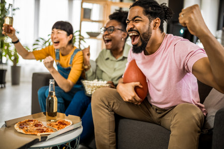 Multiracial group of friends watching rugby.の写真素材