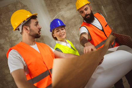 Construction team planning a building blueprint project on site with collaboration for architect innovation. Architecture, design and engineers with teamwork for successfulの写真素材