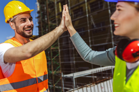 Contractor. construction worker team hands shaking after plan project contract  at construction site, contractor, engineering, partnership, construction conceptの写真素材
