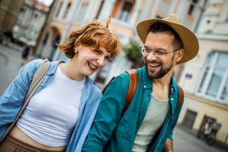 Young couple having fun on their vacation. Looking at the monuments and buildings. Travelling concept.の写真素材