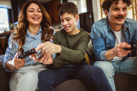 Latino family playing video games with their controllers.の写真素材