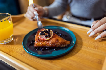 Closeup of delicious pie that girl is eating.の写真素材
