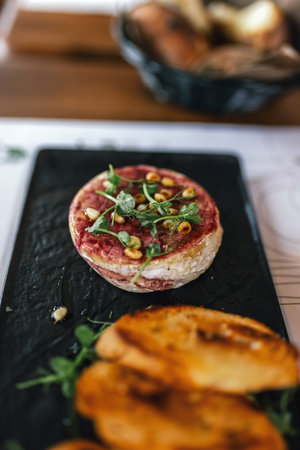 Bruschetta served as appetizer on a gathering in a restaurant. Food and drink concept.の写真素材