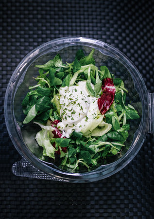 Healthy organic salad packed in a plastic container.の写真素材