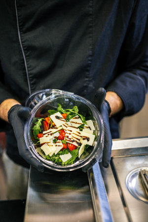 Healthy organic salad packed in a plastic container.の写真素材