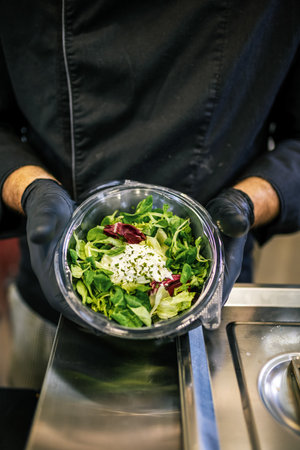 Healthy organic salad packed in a plastic container.の写真素材