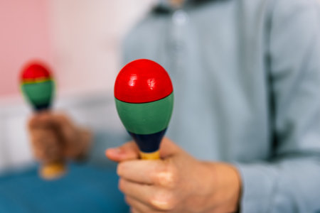 Boy plays rattle at home.の写真素材