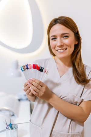 Beautician showing all the colors for gel nail polish.の写真素材