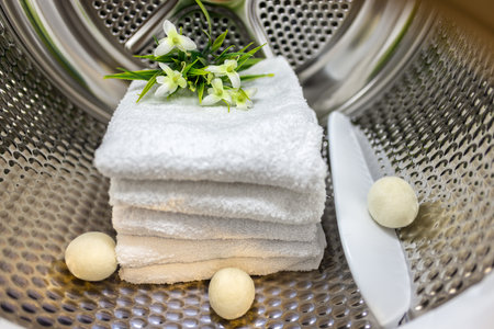Clean white towels smell nice after being washed in the washing machine.