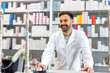 Portrait of a pharmacist standing in a drugstore.の写真素材