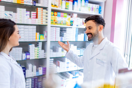 Shot of two pharmacists working together in a drugstoreの写真素材