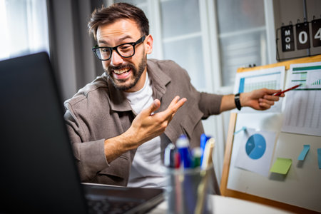 Man giving a presentation during a video call from home.の写真素材