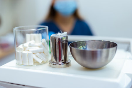 Close-up of cotton rolls and gauze pads used in dental procedures. Clean and sterile environment in...