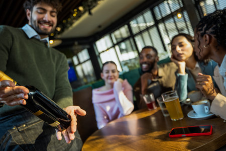 Waiter recommending wine to group of friends in cafe
