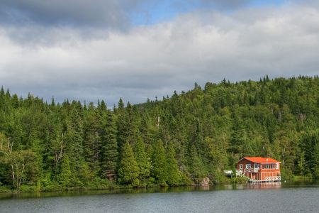 Detail of a Quebec Lake with a Red Houseの写真素材