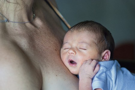 Newborn Baby Girl relaxing inside her Bedの写真素材
