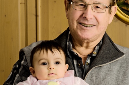 Grandfather embracing her Nephew with Love, Italyの写真素材