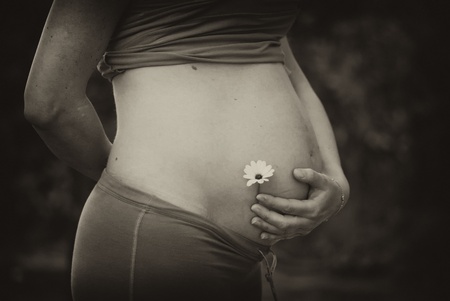 35th Week Pregnant Woman Belly with a Flower