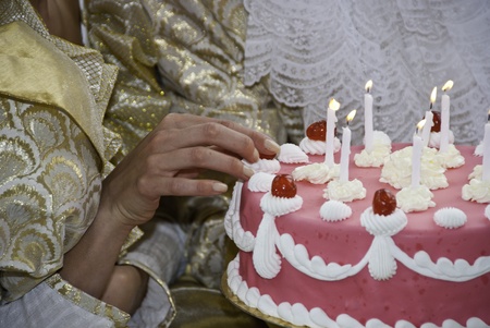 Woman Touching her Birthday Cake, Franceの写真素材